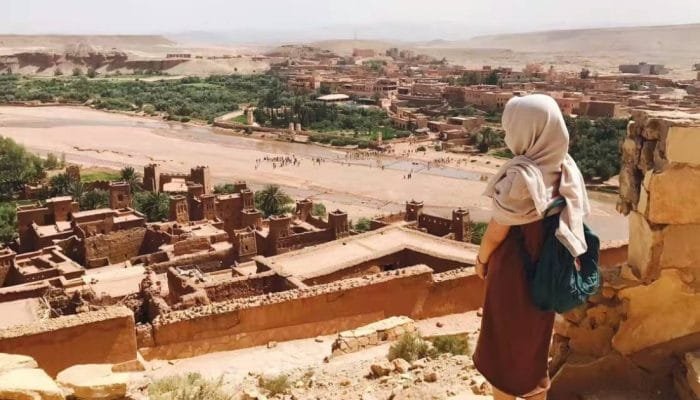 a woman looking at a city