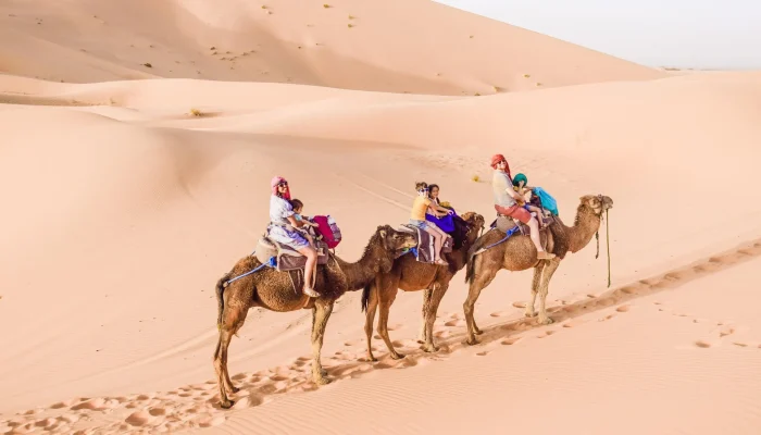 family-camel-ride-sahara-morocco