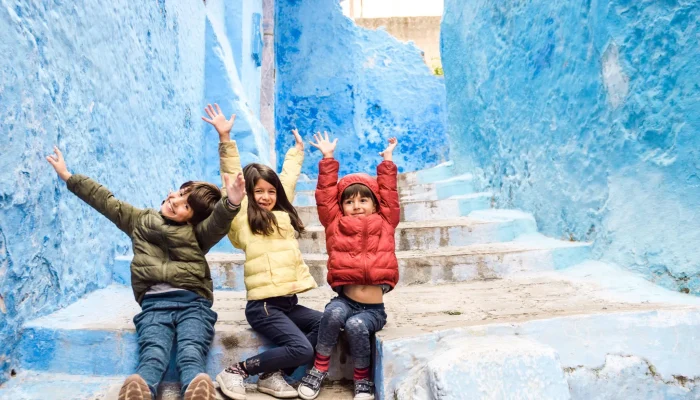 kids-excited-morocco-family-travel-chefchaouen-1