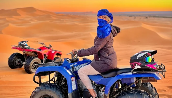 a woman on a four wheeler in the desert