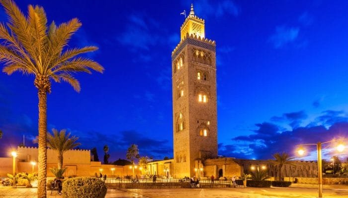 a tall tower with lights at night